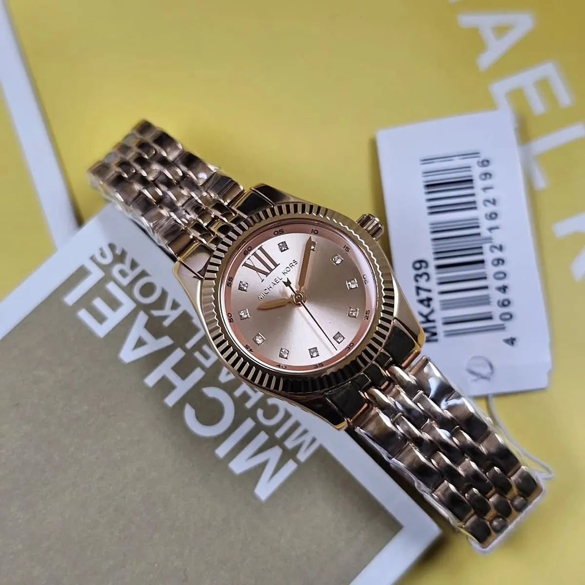 Montre Michael Kors Lexington à trois aiguilles avec cadran en or rose et bracelet en acier or rose pour femme - MK4739